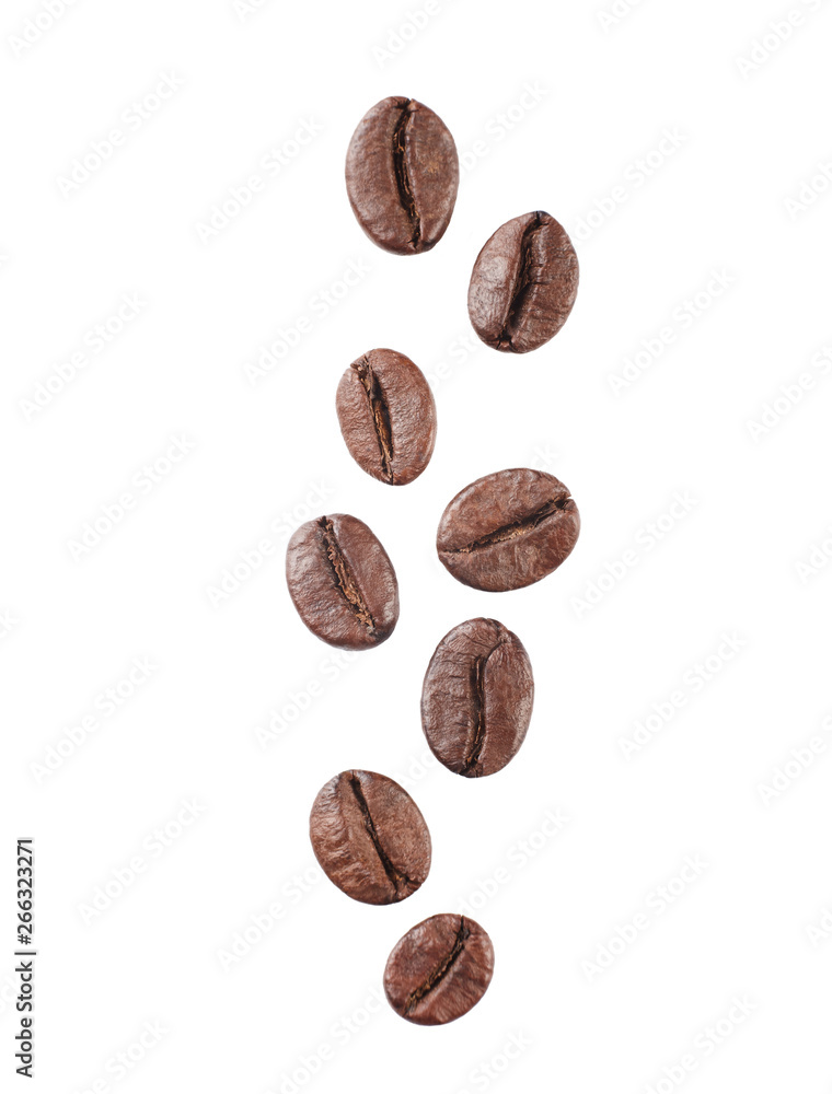 Falling coffe beans isolated on white background. Close up. Falling coffe beans isolated on white background. Close up.