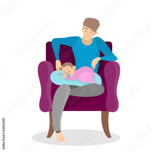 Dad sitting in armchair and holding sleeping baby