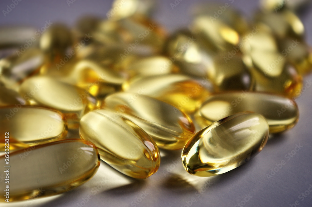 Fish oil capsules with omega 3 and vitamins A & D. Healthy lifestyle. Pharmacy industry.Healthy lifestyle. Background suplement Fish oil capsules with omega 3 and vitamins A & D. Healthy lifestyle. Pharmacy industry.Healthy lifestyle. Background suplement