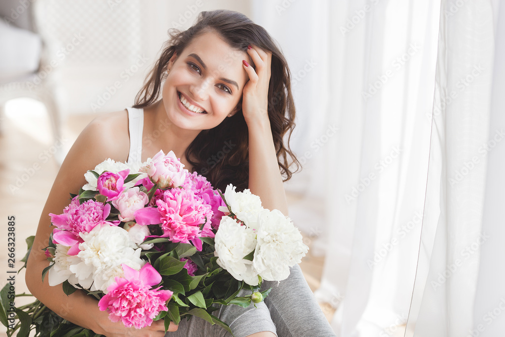 Close up portrait of young beautiful woman with flowers