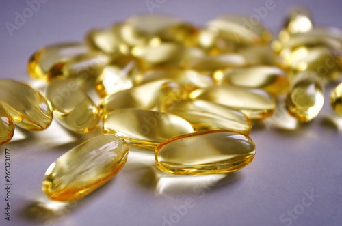 Fish oil capsules with omega 3 and vitamins A & D. Healthy lifestyle.Pharmacy industry