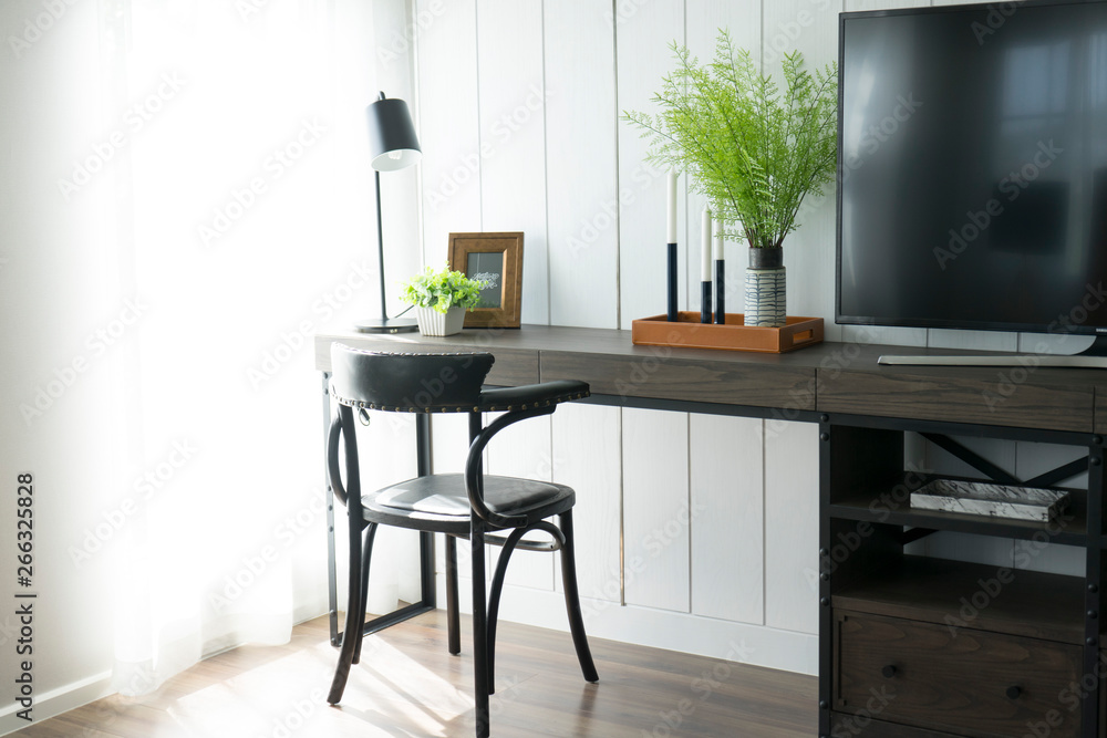 Fototapeta premium Wooden table or desk with a chair in a room
