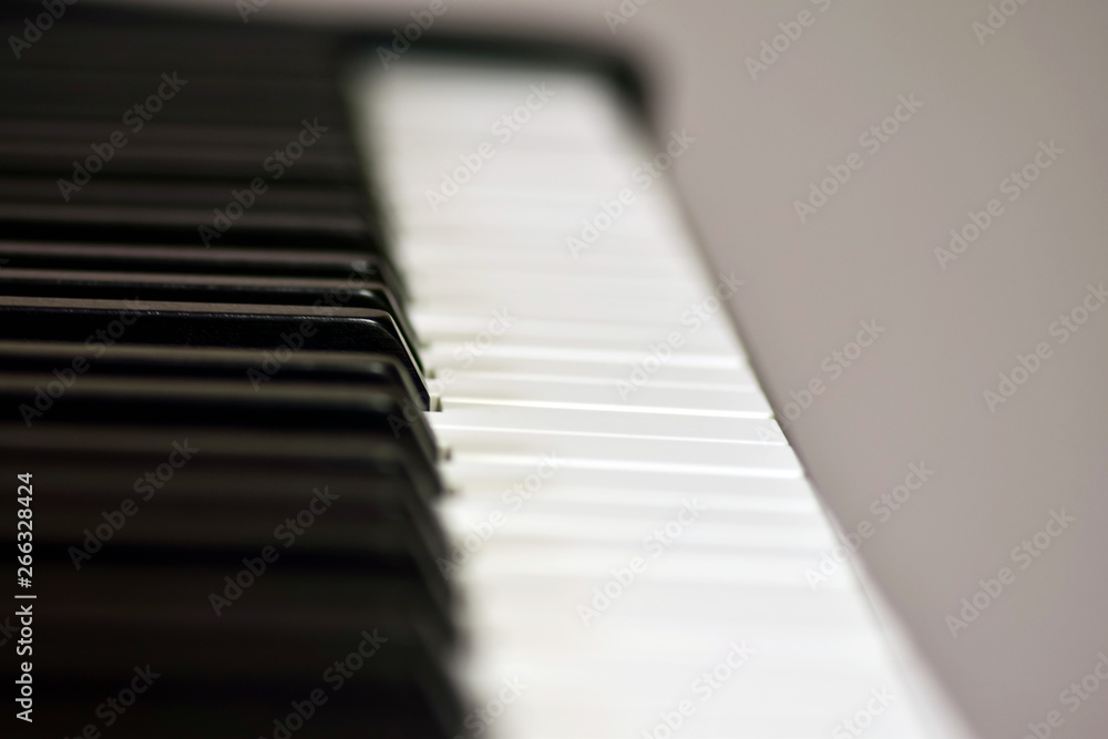 Keys of a digital piano, soft focusing, creative mood of a person improvisation and creativity. Midi piano keyboard for playing digital music and making remixes. Keys of a digital piano, soft focusing, creative mood of a person improvisation and creativity. Midi piano keyboard for playing digital music and making remixes.