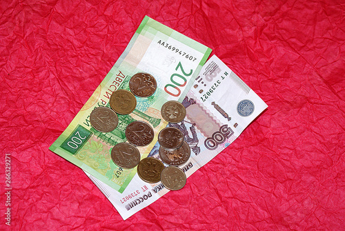 Russian money and coins on a bright background. photo