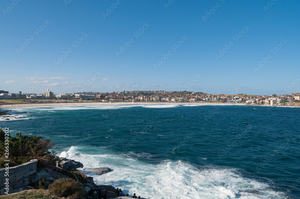 Bondi beach panorama with calm ocean on a sunny day
