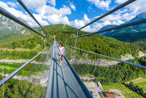 Fototapeta Naklejka Na Ścianę i Meble -  Suspension Bridge at Reutte between two hills in beautiful landscape Scenery of Alps, Tirol, Austria