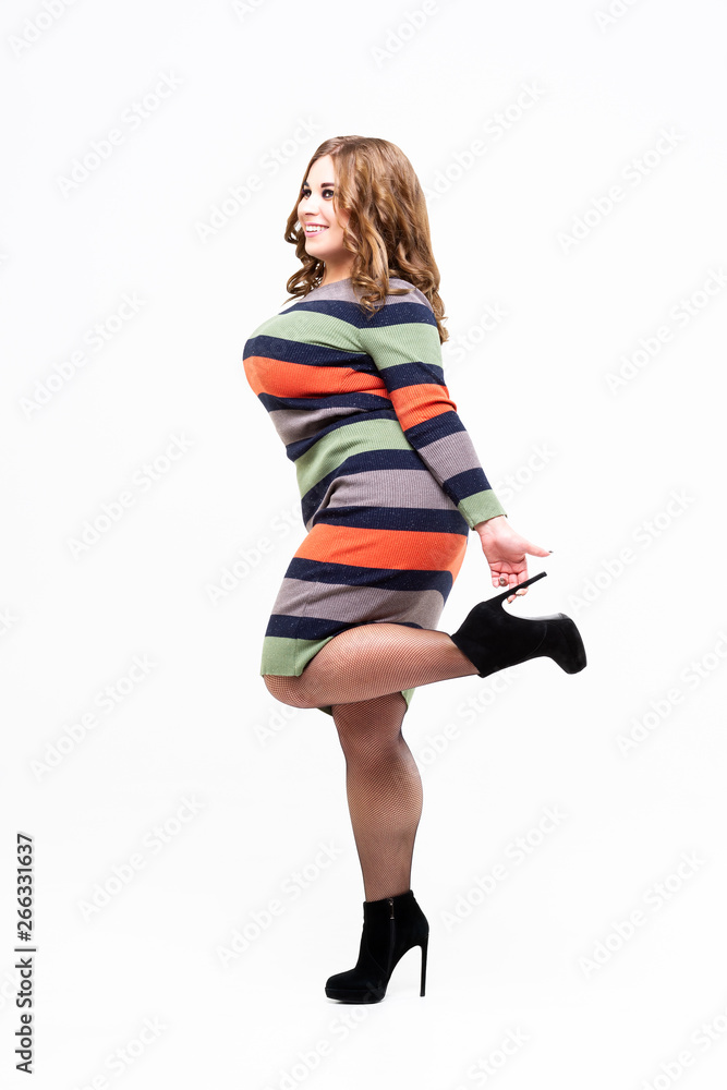 Plus size model in colored striped dress, sexy fat woman on white  background, body positive concept Stock Photo | Adobe Stock