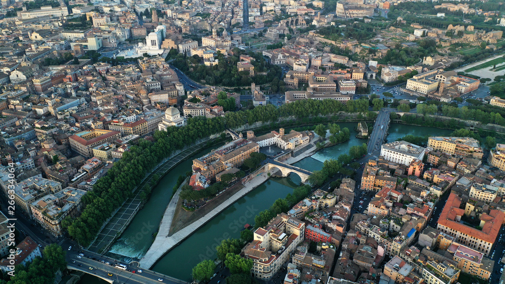 Fototapeta premium Aerial view of hospital on the Tiber Island, on the Tiber River, Rome, Italy. Coliseum.