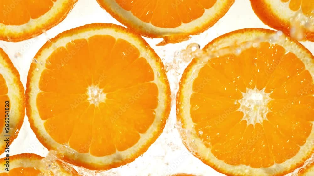 Super slow motion of orange slices with water splash. Filmed on high speed cinema camera, 1000 fps. Super slow motion of orange slices with water splash. Filmed on high speed cinema camera, 1000 fps.