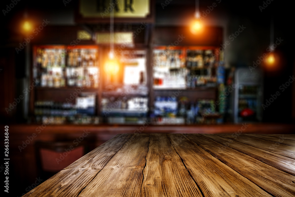 Table background of free space and blurred background of bar Table background of free space and blurred background of bar
