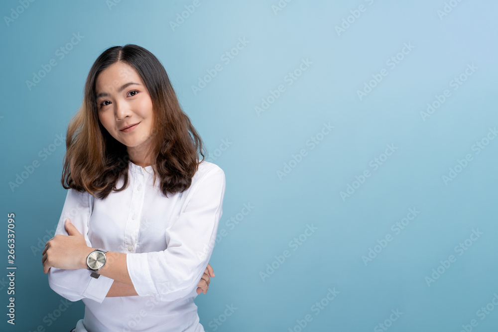 Portrait of a confident woman standing isolated over background Portrait of a confident woman standing isolated over background
