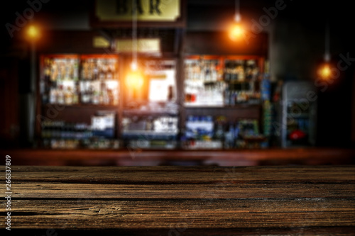Table background of free space and blurred background of bar  © magdal3na