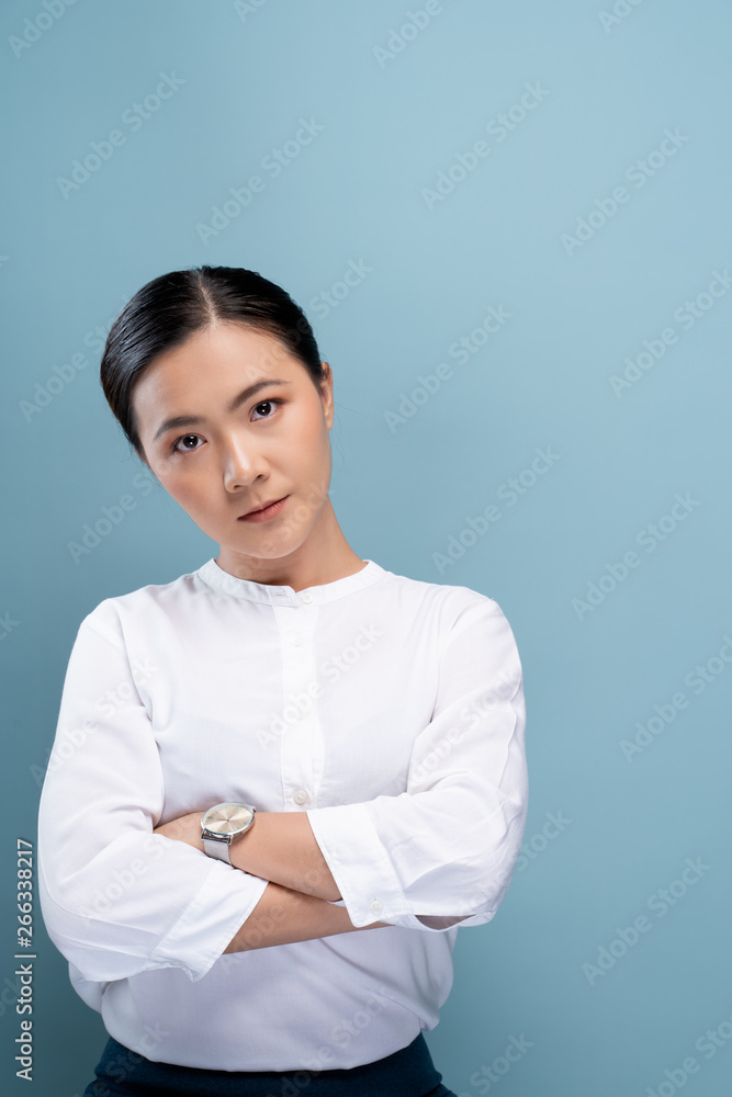 Portrait of a confident woman standing isolated over background Portrait of a confident woman standing isolated over background