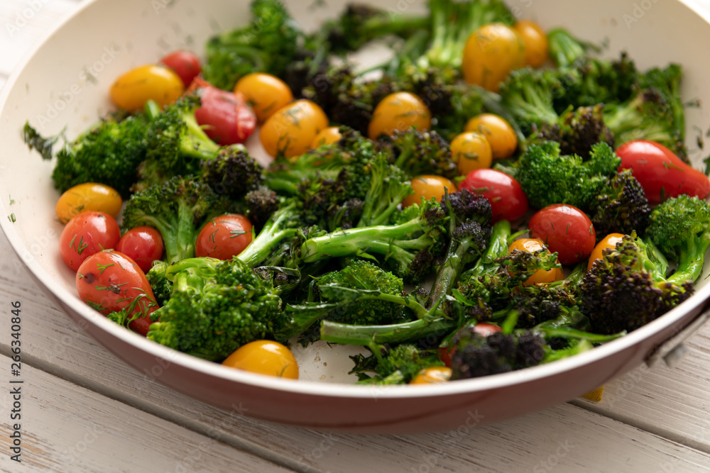 Green Broccoli Florets Sauteed with Heirloom Cherry Tomatoes and Fresh Herbs Green Broccoli Florets Sauteed with Heirloom Cherry Tomatoes and Fresh Herbs