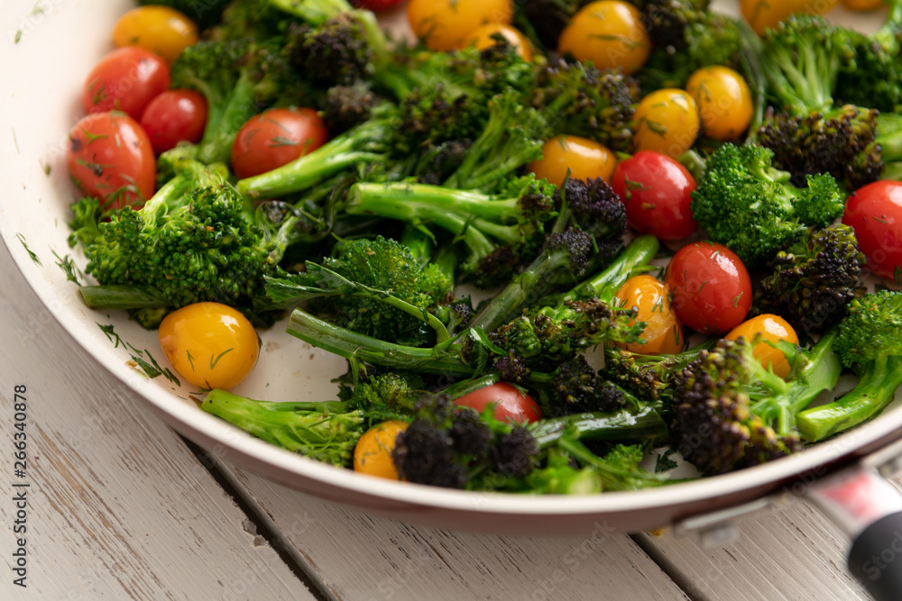 Green Broccoli Florets Sauteed with Heirloom Cherry Tomatoes and Fresh Herbs