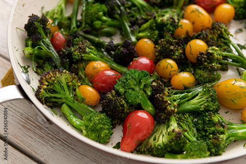 Green Broccoli Florets Sauteed with Heirloom Cherry Tomatoes and Fresh Herbs