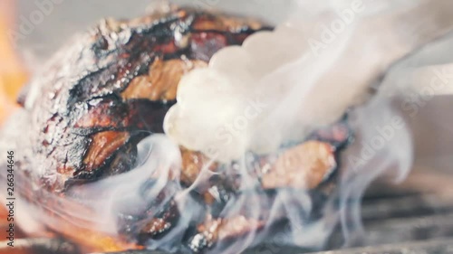 Wallpaper Mural Chief using the spatula and turning the meat on the grill. Fire is burning, hot juicy oil steak cooking close up slow motion. Grill, tasty beefsteak slow motion Torontodigital.ca