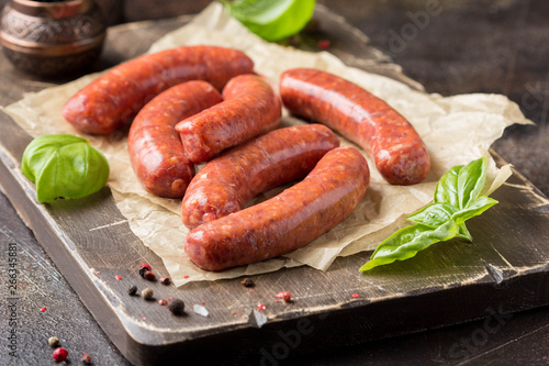 Raw grilled sausages with meat (beef, pork, lamb) and spices, hot merguez, kabanos, chorizo. Delicious food for picnic