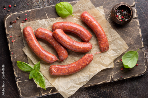 Raw grilled sausages with meat (beef, pork, lamb) and spices, hot merguez, kabanos, chorizo. Delicious food for picnic photo