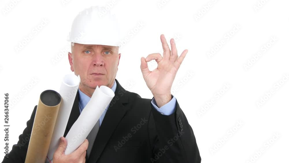 Serious Engineer in a Meeting with Projects in Hand Make OK Hand Sign Serious Engineer in a Meeting with Projects in Hand Make OK Hand Sign