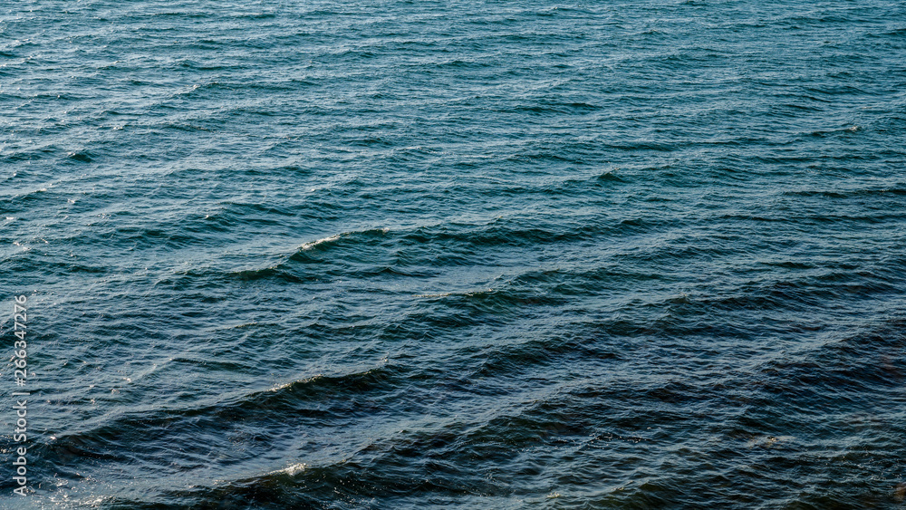 Sea surface as natural background, color toned. Sea surface as natural background, color toned.