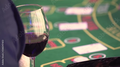 Dealer spreading the deck at poker game in casino