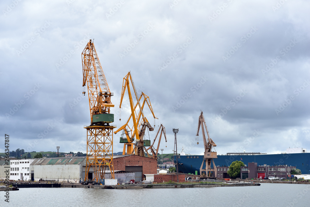 Cranes in in cargo seaport of Astillero, Santander, Spain