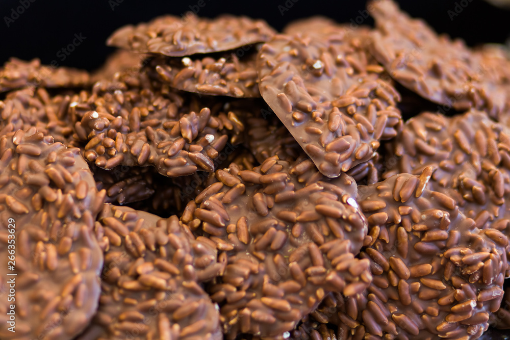 Selling sweets at a street fair in Budapest. Chocolate cookies of different tastes on the counter. Selling sweets at a street fair in Budapest. Chocolate cookies of different tastes on the counter.