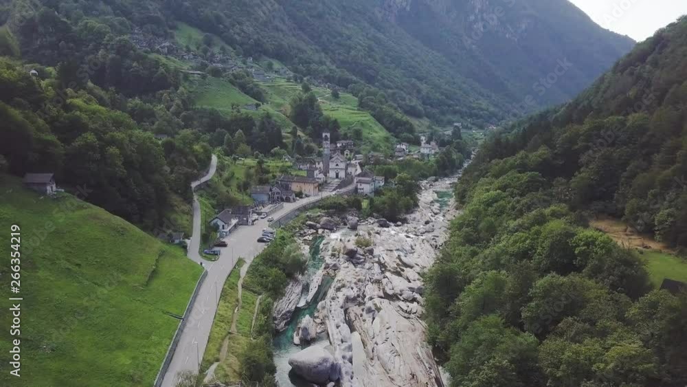 Drone flies over a Swiss natural landscape in the green mountains near a medieval village. Concept of ecological environment without pollution. Drone flies over a Swiss natural landscape in the green mountains near a medieval village. Concept of ecological environment without pollution.