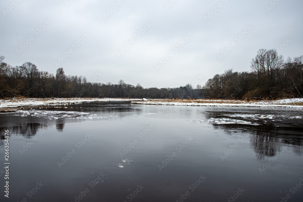 almost frozen river in winter