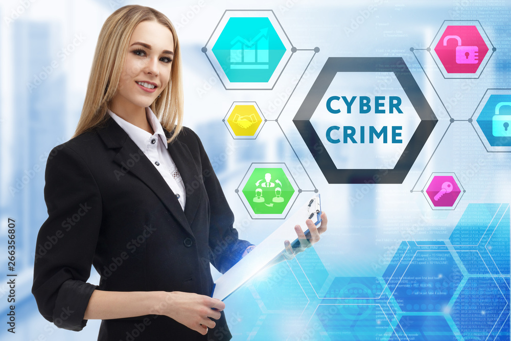 The concept of business, technology, the Internet and the network. A young entrepreneur working on a virtual screen of the future and sees the inscription: Cyber crime The concept of business, technology, the Internet and the network. A young entrepreneur working on a virtual screen of the future and sees the inscription: Cyber crime