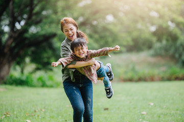 happy harmonious family outdoors concept.mother and son have activities together on holidays.