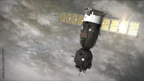 A space ship is moving in the orbit and the solar panel is reflecting the sun. It is passing from the right to the left. Background: 'Overcast'