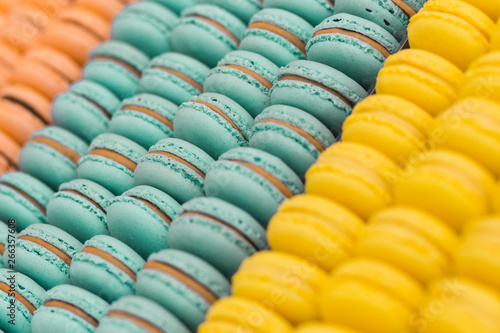 Colorful french macarons dessert with vintage pastel tones  close up. Tasty sweet color macaroon  bakery concept.