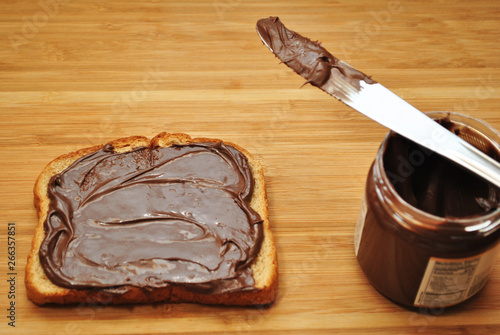 Creamy Chocolate & Nut Spread on a Slice of Wheat Toast photo