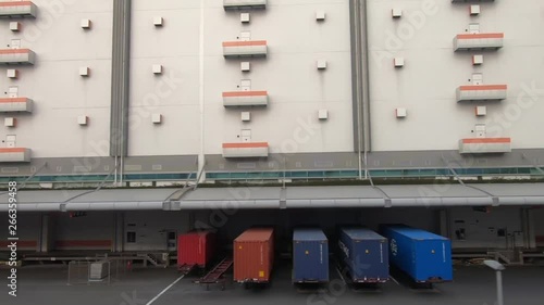 Train window with a view of the distribution warehouse area