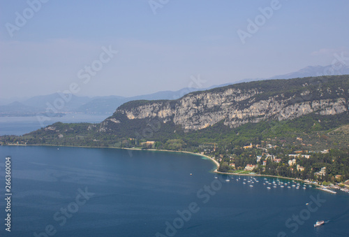Scenic mountain views of the mountains, city and lake Garda