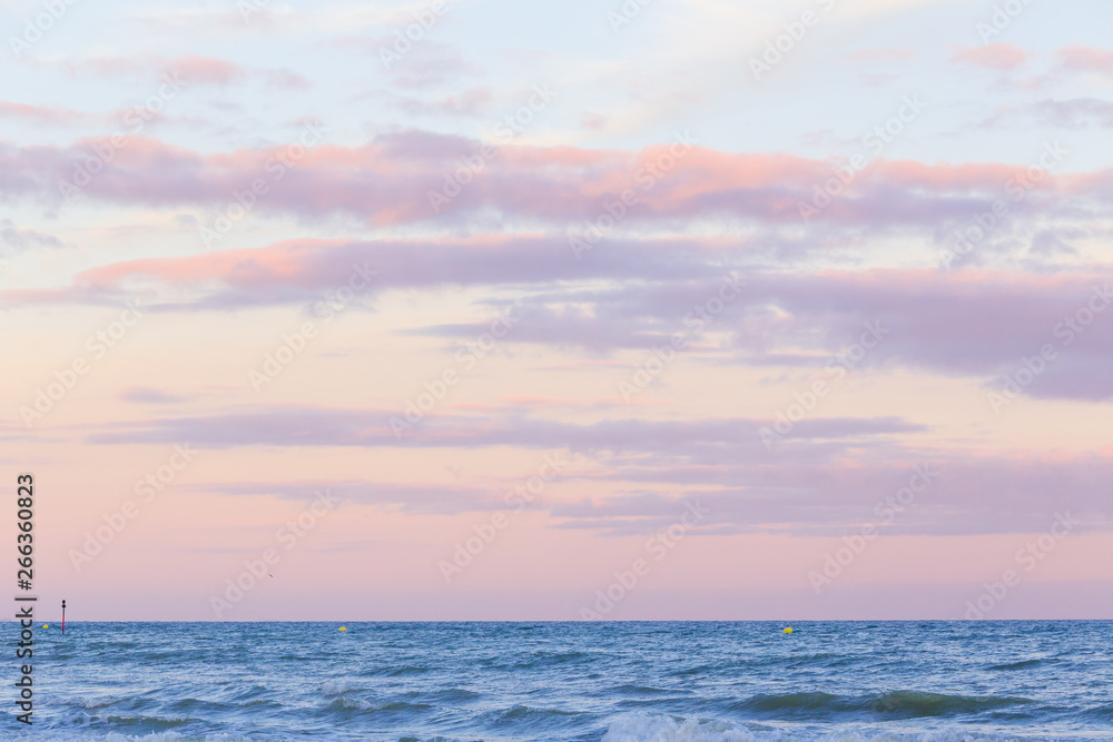 Pastel color sunset sky over the sea .