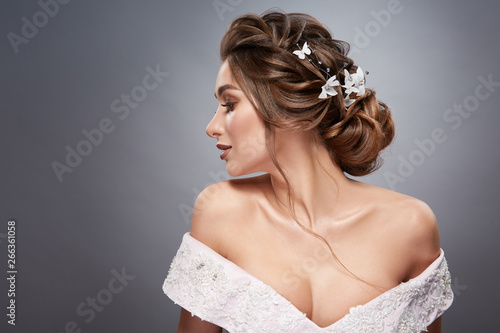 woman with flowers in the hair looking sideways
