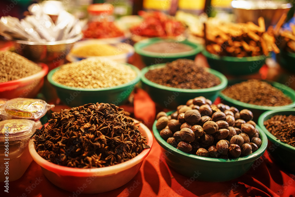 Colorful spices in bags at a market in Goa