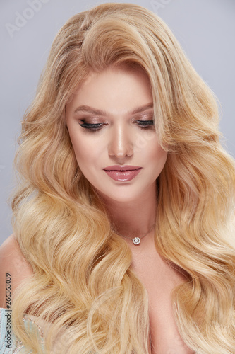 close-up portrait of handsome woman with white long hair and jewelry on her neck