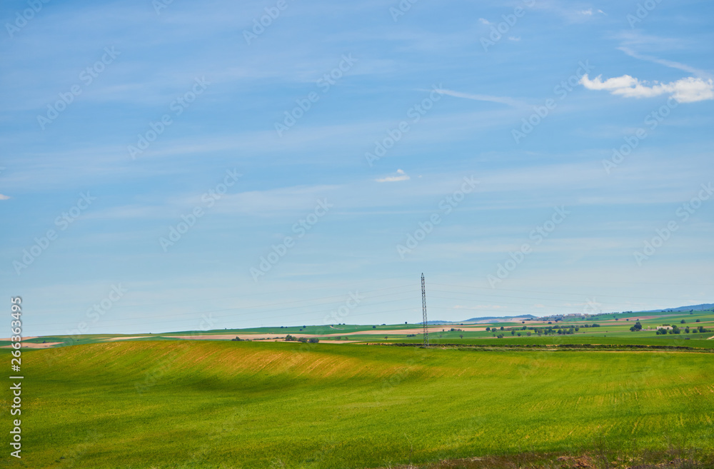 Landscape in spring with fields full of brown and green colors Landscape in spring with fields full of brown and green colors