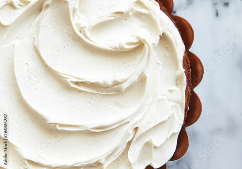 Cake with swirled vanilla frosting
