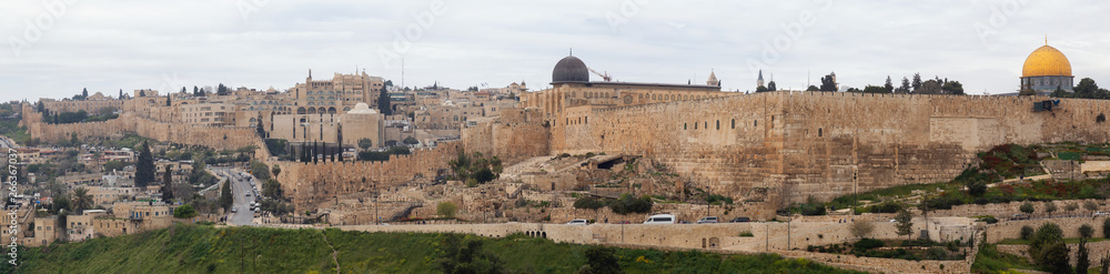 Fototapeta premium Beautiful panoramic aerial view of the Old City and Dome of the Rock during a sunny and cloudy day. Taken in Jerusalem, Capital of Israel.