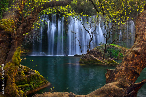 Beautiful waterfalls over emerald water in deep green forest in Kursunlu Natural Park  Antalya  Turkey