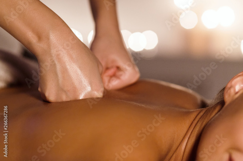 Woman Getting Back Massage From Physiotherapist  Closeup