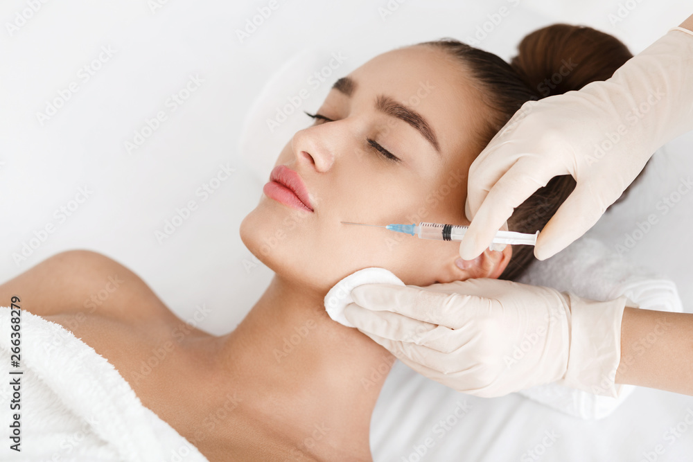 Plastic Surgery. Young Woman Receiving Botox Injection