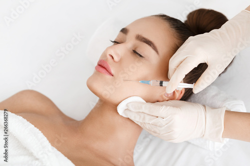 Plastic Surgery. Young Woman Receiving Botox Injection