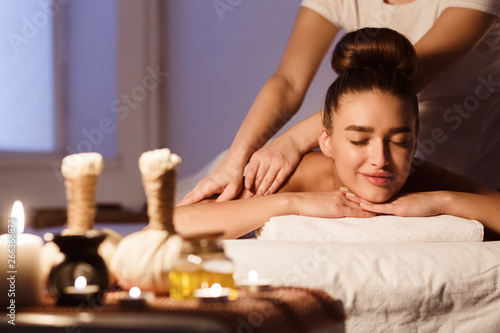 Total Relaxation. Woman In Spa Salon With Herbal Bags On Foreground
