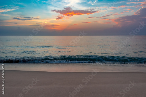 colorful sky above calm ocean waters at dawn